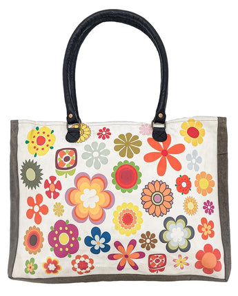 Colorful floral-patterned bag with black handles on a white background