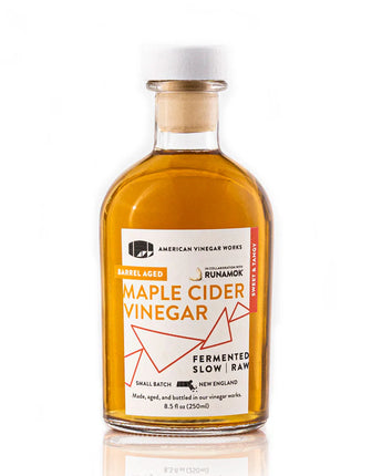 Bottle of Maple Cider Vinegar with a label on a white background