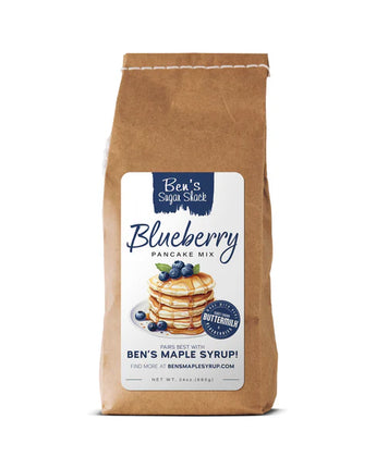 Bag of Ben's Blueberry Pancake Mix with a label featuring a stack of pancakes topped with syrup and blueberries on a white background