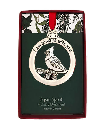 Holiday ornament with cardinal design and 'I am always with you' text on a decorative card.