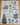 Tea towel with Christmas-themed illustrations and text on a wooden surface