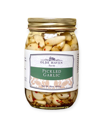 Jar of Olde Haven Farm pickled garlic on a white background