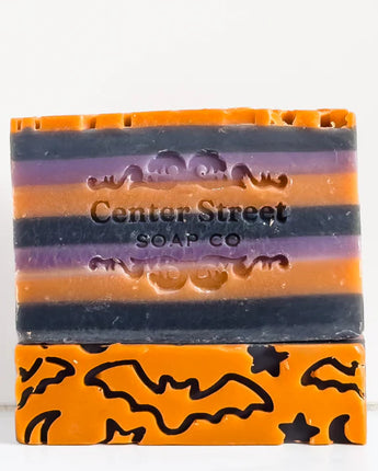 Stack of Halloween-themed soap bars with 'Center Street Soap Co' branding on a white background