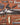 Book cover of 'The Brown Bess' with a flintlock musket and related components on a wooden background.