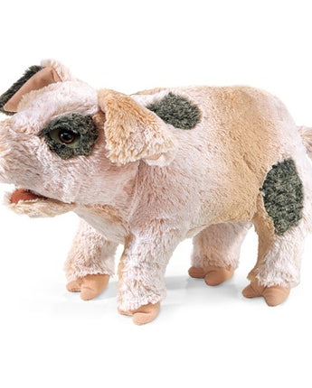 Plush toy pig with black spots on a white background