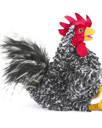 Plush salt and pepper black and white rooster puppet toy with a red comb on a white background