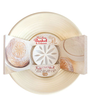A beige bread proofing basket embosser with a removable embosser, packaged with a product label showing an image of the embossed bread.