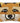 A hand-hooked wool decorative pillow designed to resemble a fox face, with a combination of brown, beige, and black colors.