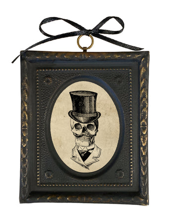 Decorative frame with a skull wearing a top hat design on a white background