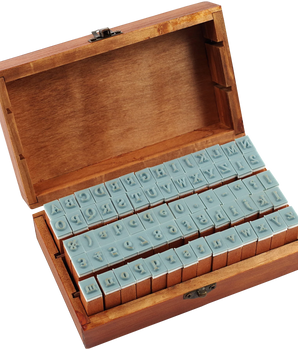 Wooden box with letter stamps on a white background