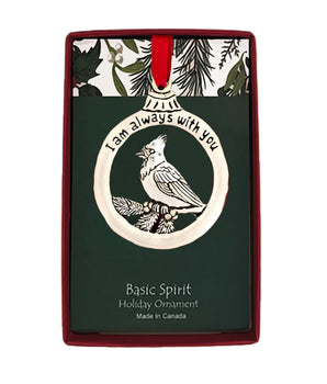Holiday ornament with cardinal design and 'I am always with you' text on a decorative card.
