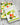 Two kitchen towels with vegetable patterns on a wooden surface