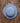 Blue straw hat on a wooden surface