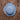 Blue straw hat on a wooden surface