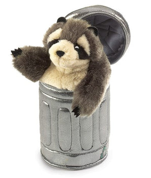 Plush toy raccoon in a trash can on a white background