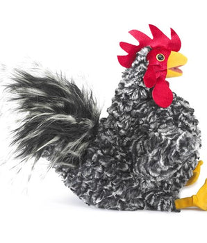 Plush salt and pepper black and white rooster puppet toy with a red comb on a white background