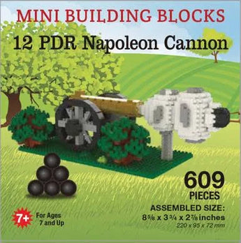 Mini building blocks set with Napoleon Cannon design on a grassy field background